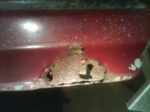 1990 Ford F-350 - This part of a vehicle shows extensive rust and deterioration.
