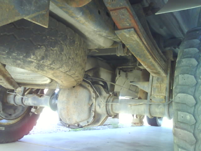 1990 Ford F-350 rear axle and leaf springs, with spare tire visible