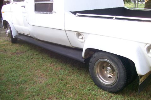 1982 Ford E350 - Side view of a white 1982 Ford E350 van with dual rear wheels and black running boards.
