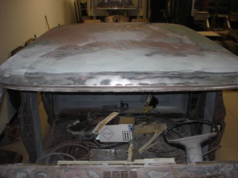 1979 Ford F-250 - Interior view of a vehicle's cabin, showing exposed wiring and a steering wheel, with the roof stripped for repair.