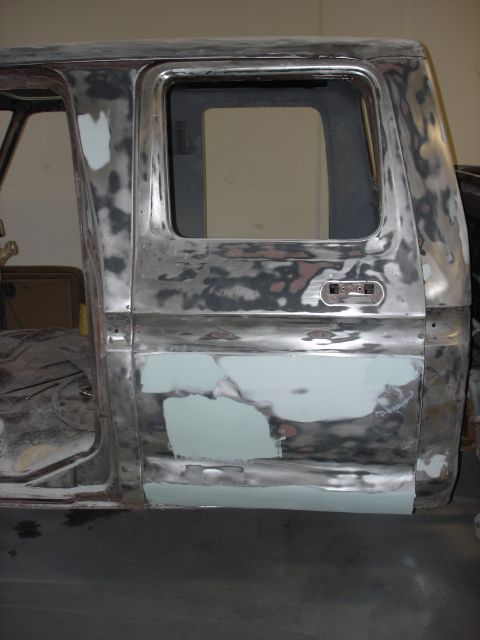 1979 Ford F-250 - Body panels of a 1979 Ford F-250 crew cab are prepped for paint with primer and filler.
