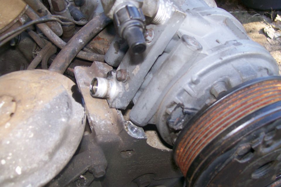 The new engine didn't have air conditioning, and my old engine is a V-belt, the new one is serpentine.  Luckily, I saved the air conditioner from the Black bronco, however, it didn't fit the bracket, so I ended up having to do some clearancing.
