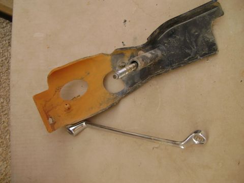 1998 Ford Crown Victoria - Close-up of a disassembled automotive component with a chrome handle.