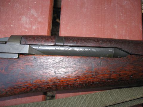 2000 Ford Crown Victoria - Receiver markings on an M1 Garand rifle show serial number and manufacturer information.