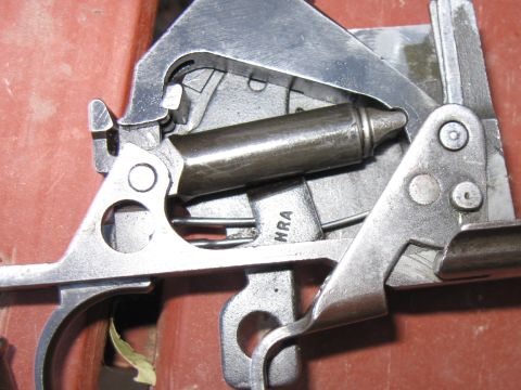 2000 Ford Crown Victoria - Internal components of a firearm, showing intricate metalwork and a visible 'HRA' marking.
