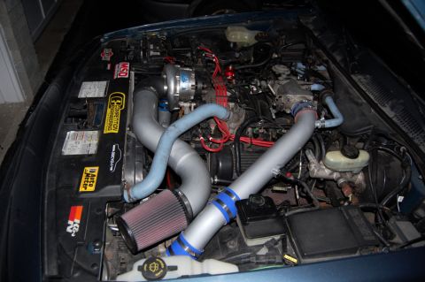 1985 Mercury Grand Marquis - Aftermarket turbocharger and intake system installed in an engine bay.