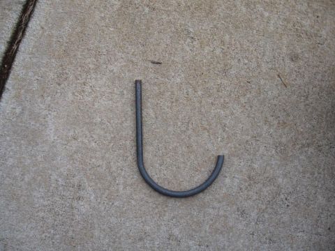 1995 Ford F-150 - A metal hook is shown on a concrete surface.
