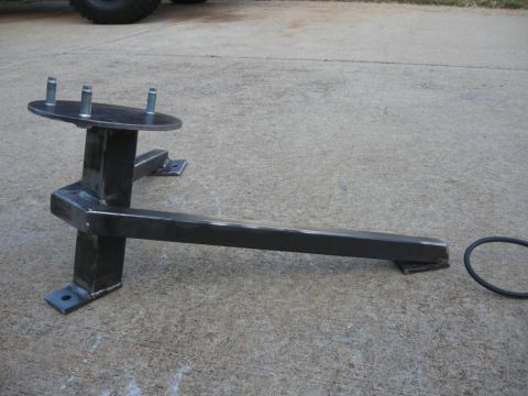 1995 Ford F-150 - This custom-fabricated spare tire mount is designed to hold a spare wheel securely.