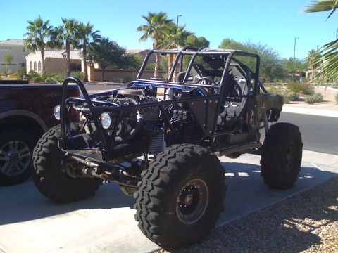 1966 Ford Bronco - This heavily modified off-road vehicle features a custom tube chassis and exposed mechanical components, not a 1966 Ford Bronco.