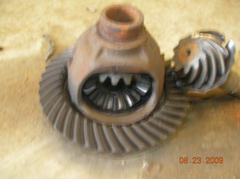 1991 Ford F-150 - Differential gears, likely from a vehicle's drivetrain, are shown disassembled. The date 08.23.2009 is visible.