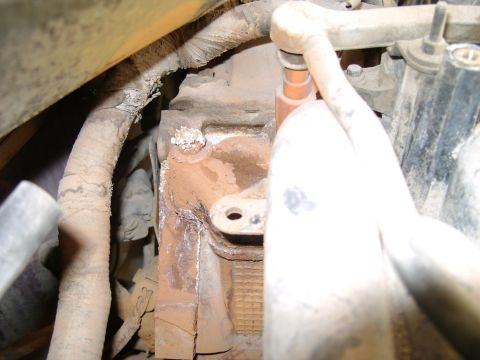 1998 Ford Crown Victoria - Detail of an engine part, showing wear and corrosion.