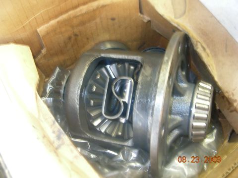 1991 Ford F-150 - Close-up of a differential assembly with visible gears and a bearing, packaged in a cardboard box.