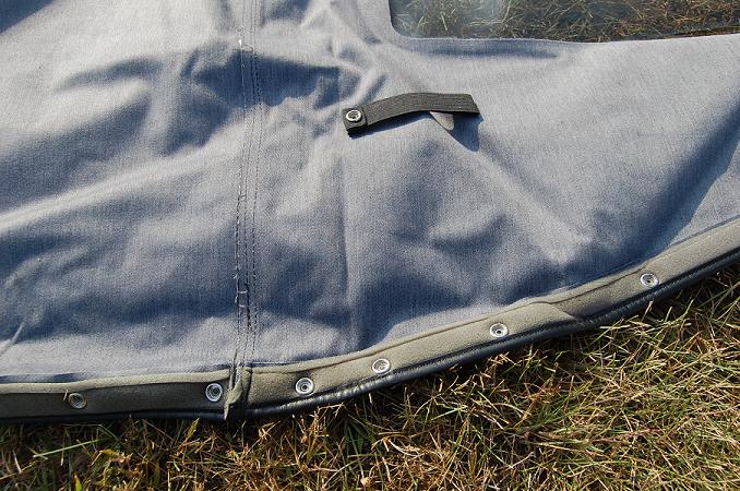 Gray soft top fabric with snaps and a strap
