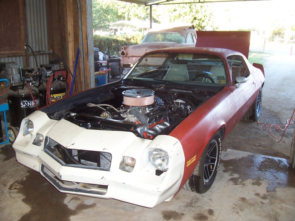 1979 Chevrolet Camaro, red and white, hood open, showing engine
