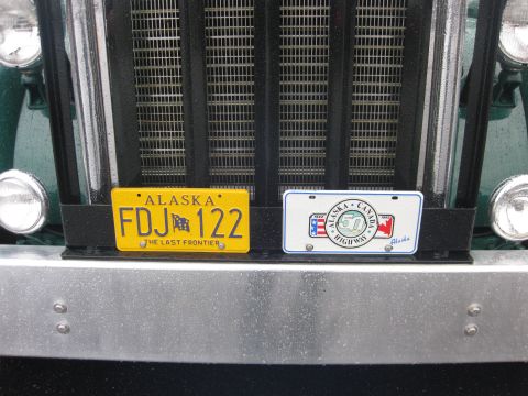 1981 Kenworth W900A - Truck grille with Alaska and Alaska-Canada Highway license plates.