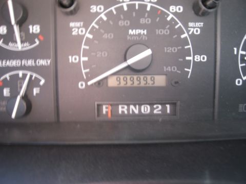 1986 Ford Bronco - The vehicle's odometer reads 999999.9, and the gear selector is in reverse.