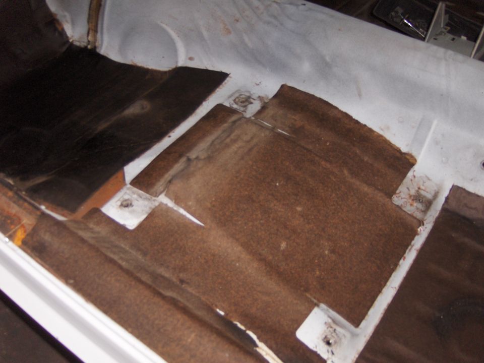 Interior floor pan with sound deadening material removed