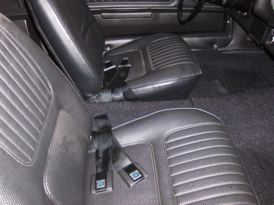 Black vinyl bucket seats with seat belts in a 1970 Chevrolet Camaro interior