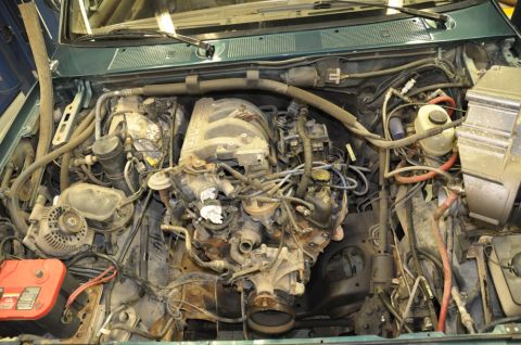 1996 Ford Bronco - Engine bay of a 1996 Ford Bronco, showing the V8 engine and associated components.
