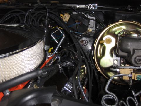 1970 Chevrolet Camaro - Engine bay view of a 1970 Chevrolet Camaro, a chrome air cleaner and gold-colored brake booster assembly.
