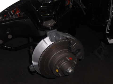 1970 Chevrolet Camaro - Close-up of a vehicle's front disc brake assembly, showing the rotor and caliper.