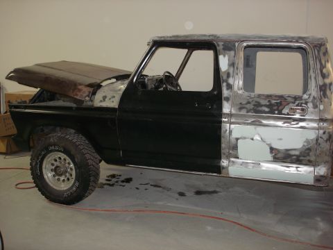 1979 Ford F-250 - This truck is in the process of being repaired and repainted, with various stages of bodywork visible.