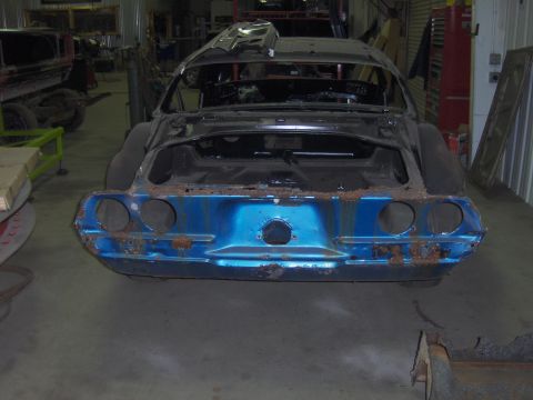 1970 Chevrolet Camaro - The rear of a 1970 Chevrolet Camaro body, in a state of disrepair, sits in a garage.