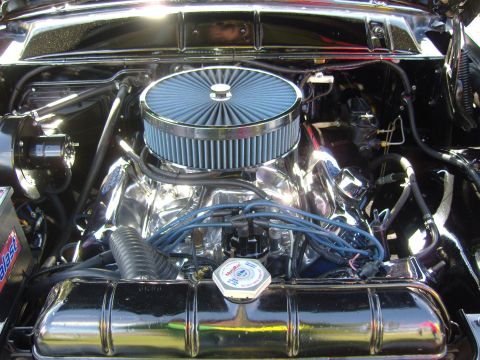 2007 Ford Mustang - Close-up view of a car's engine bay, a chrome air cleaner and polished components.