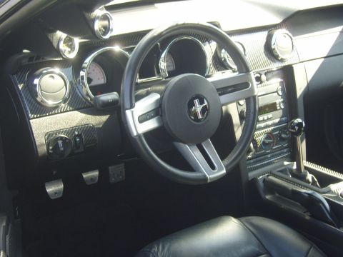 2007 Ford Mustang - Interior view of a 2007 Ford Mustang, the dashboard, steering wheel, and shifter.