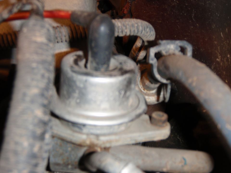 close-up of engine vacuum actuator with hoses attached