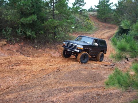 1995 Ford Bronco - This 1995 Ford Bronco navigates a challenging muddy off-road course.