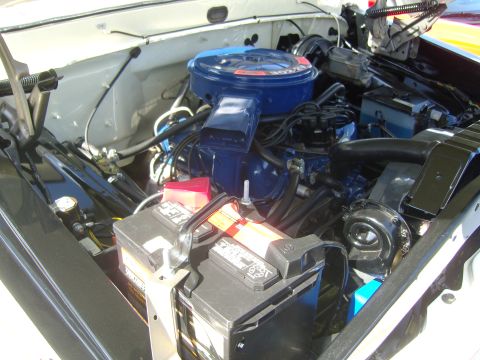 2007 Ford Mustang - Close-up view of a vehicle's engine bay, highlighting the air cleaner and battery.