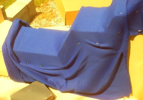 1999 Ford Taurus - A car seat is covered in blue fabric, with some pins visible on the material.
