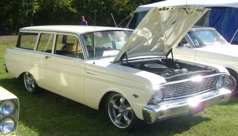 2007 Ford Mustang - A vintage station wagon is displayed with its hood open, revealing the engine compartment.