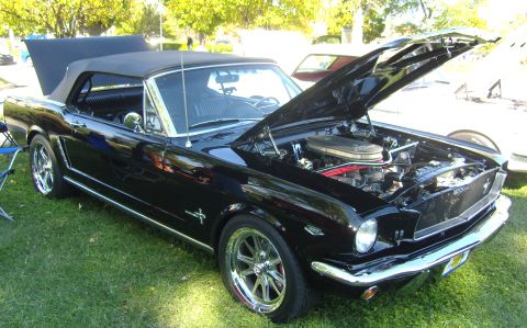 2007 Ford Mustang - A black 1965 Ford Mustang convertible is displayed with its hood open, revealing the engine compartment.
