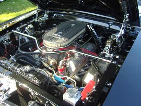 2007 Ford Mustang - Detailed view of a classic car's engine bay, polished components and an open hood.