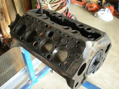 1974 Ford Ranchero - Engine block on a blue stand with gears visible on the side.