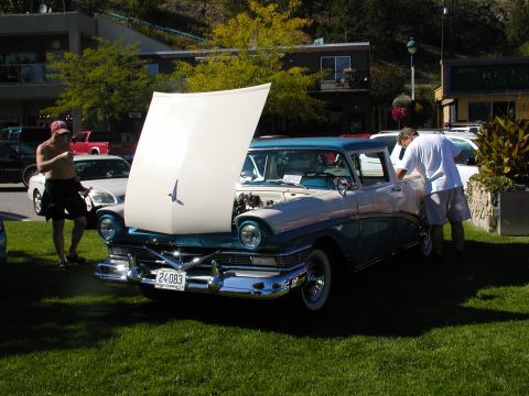 1967 Ford Ranchero - Two-tone 1957 Ford Fairlane 500 displayed with its hood up at an outdoor event.