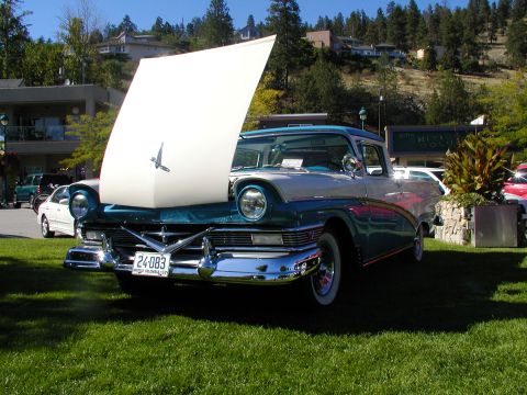 1967 Ford Ranchero - This two-tone blue and white 1957 Ford Fairlane Ranchero is displayed with its hood open at an outdoor event.