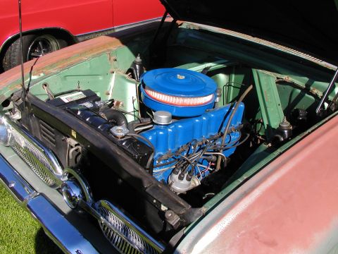 1967 Ford Ranchero - Engine bay of a 1967 Ford Ranchero, showing the blue engine and air cleaner assembly.