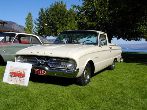 1967 Ford Ranchero - A cream-colored 1960 Ford Falcon Ranchero pickup truck is displayed on a grassy lawn next to a lake.