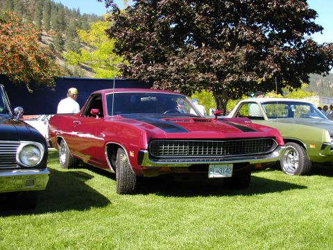 1967 Ford Ranchero - Front view of a red 1970 Ford Ranchero with black hood stripes and license plate BL-3142.