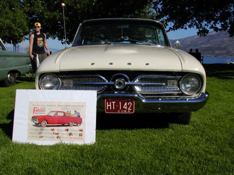 1967 Ford Ranchero - A vintage Ford Falcon Ranchero is displayed on a grassy lawn with a lake in the background.