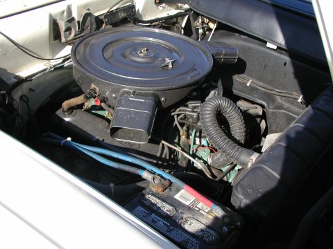 1967 Ford Ranchero - Close-up of an engine bay, focusing on the air cleaner and battery components.
