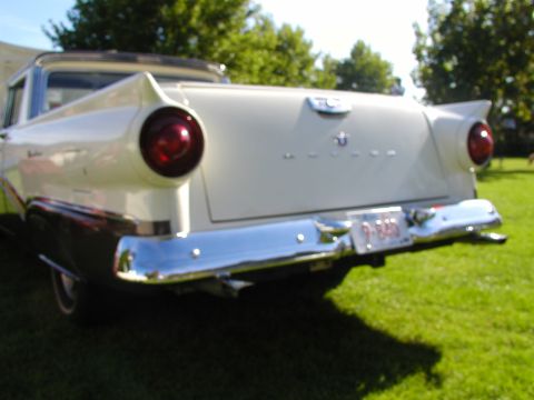 1967 Ford Ranchero - Rear view of a two-tone 1957 Ford Fairlane 500, distinctive tail fins and a chrome bumper.