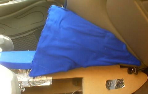 1999 Ford Taurus - Interior view of a car's passenger seat covered with a blue cloth.
