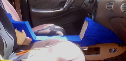 1999 Ford Taurus - A custom blue center console is installed in the interior of a vehicle, obscuring much of the original cabin details.
