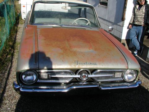 1967 Ford Ranchero - Front view of a 1967 Ford Ranchero with significant hood rust.