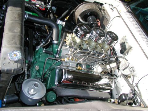 1967 Ford Ranchero - Close-up view of a modified V8 engine with chrome accents and multiple carburetors.