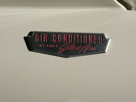 1967 Ford Ranchero - A close-up of a vehicle's "Air Conditioned by Ford Select Aire" badge is visible.